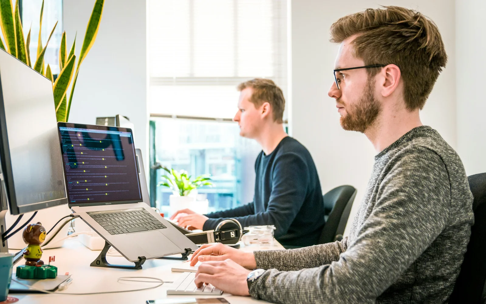 Support specialist with a headset at a laptop