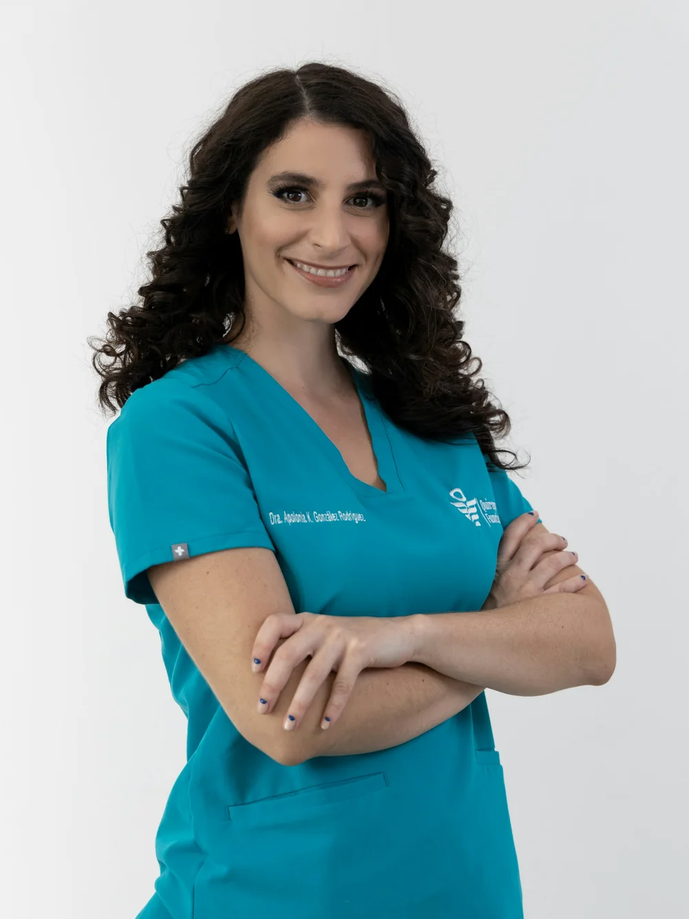 Clinical team member in teal scrubs